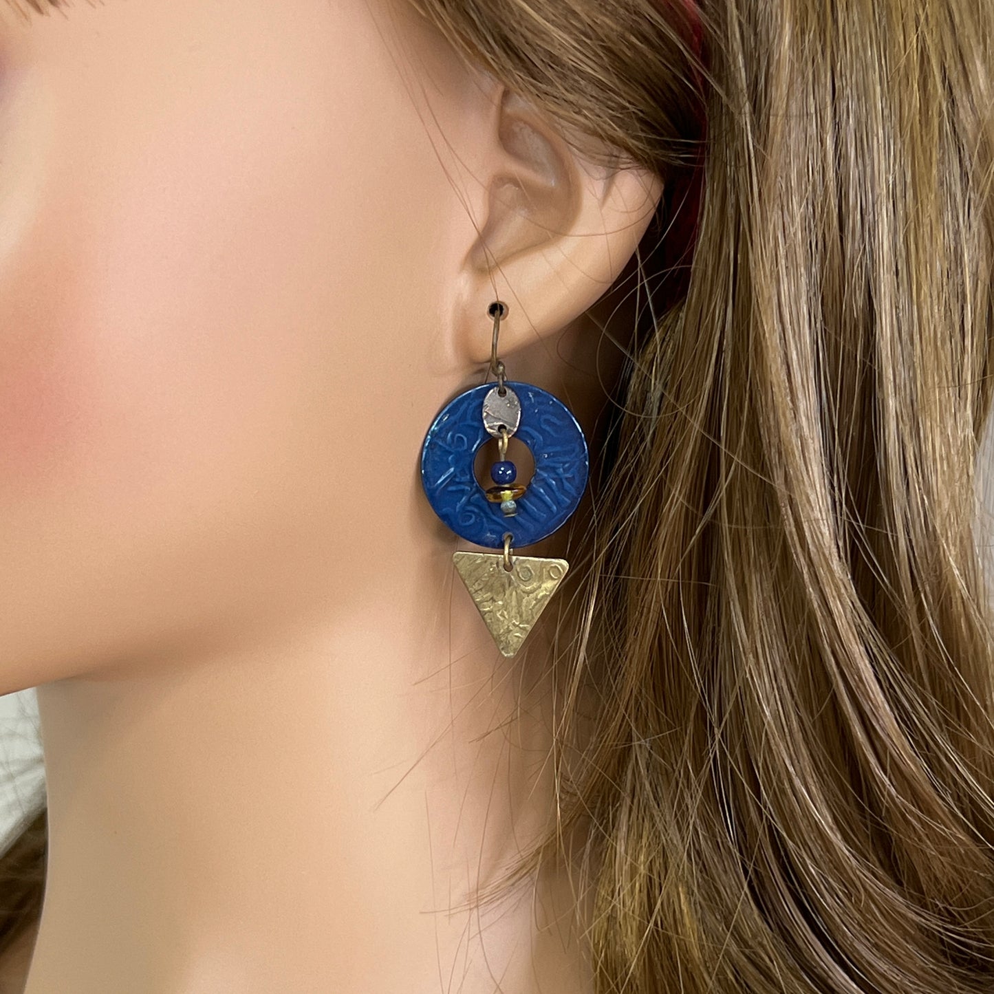 Model wearing vintage blue enamel and brass artisan geometric earrings