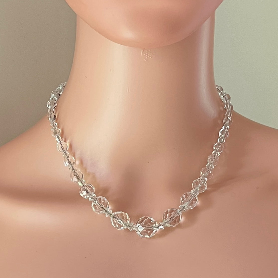 Mid-century crystal necklace displayed on mannequin bust