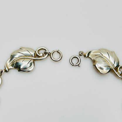 Close up of spring ring clasp and leaf links vintage necklace