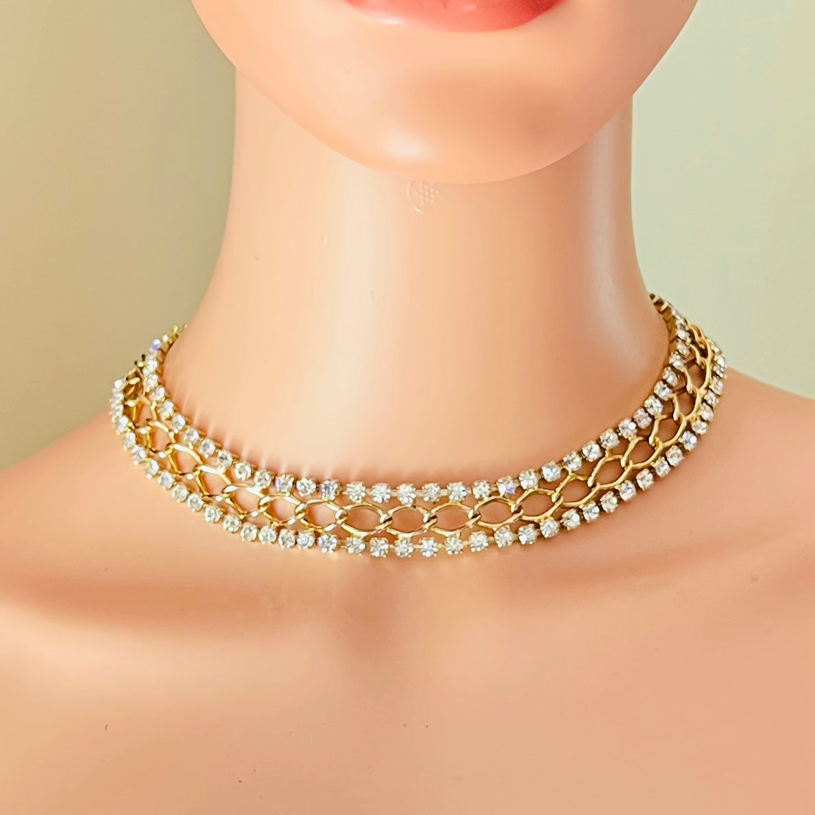 Mid-century gold tone rhinestone choker necklace styled on mannequin