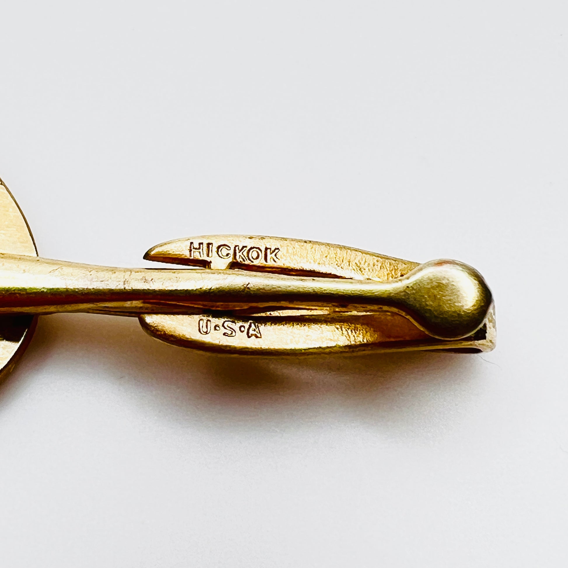 Close-up of Hickok U.S.A. signature on vintage horseshoe tie clip