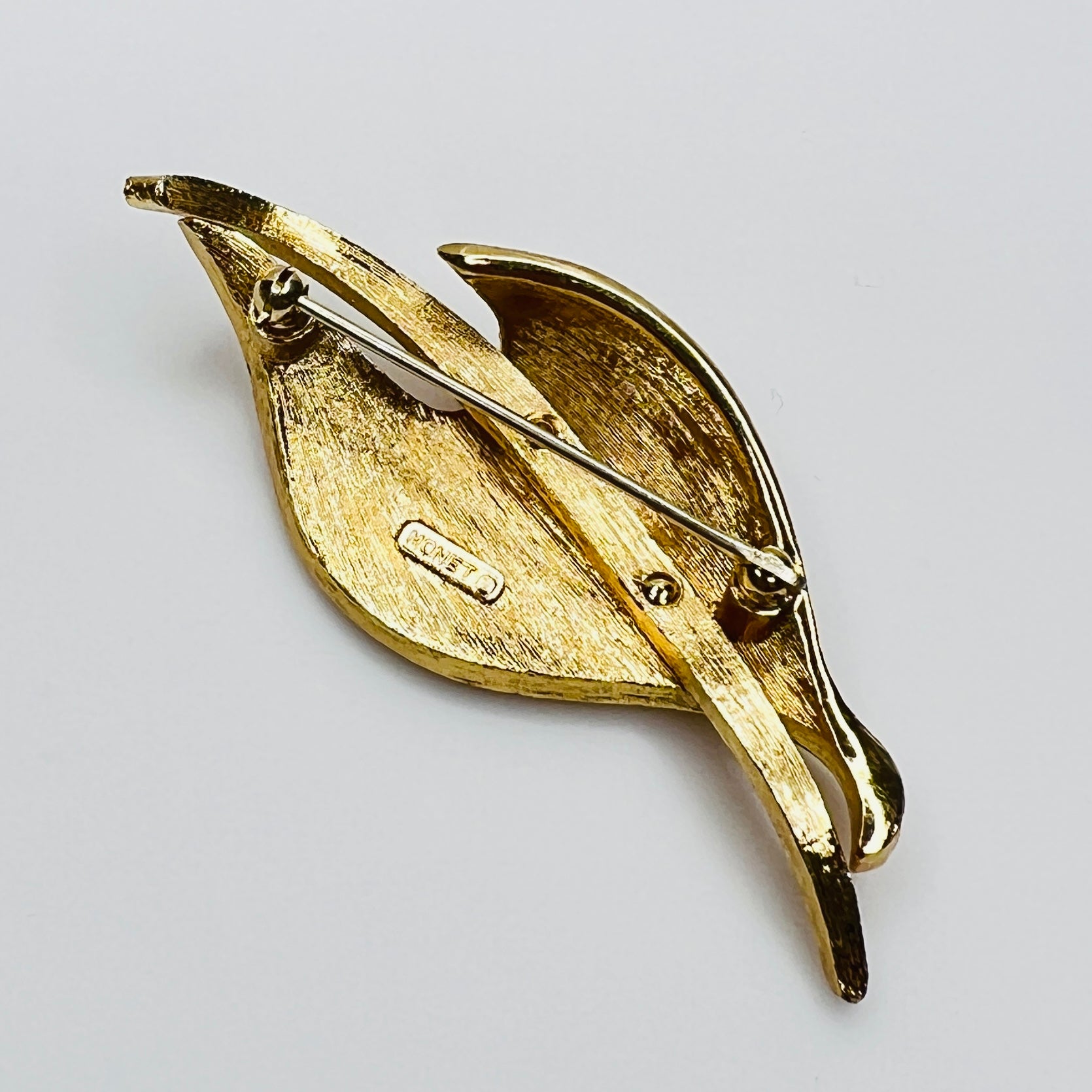 Reverse of signed Monet brooch with clasp