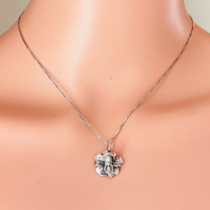 Vintage sterling silver Madonna flower pendant necklace worn on mannequin