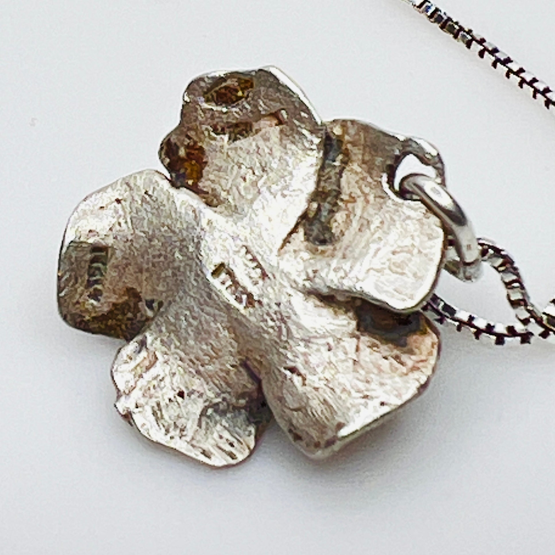 Reverse of vintage Madonna pendant showing Italy hallmark