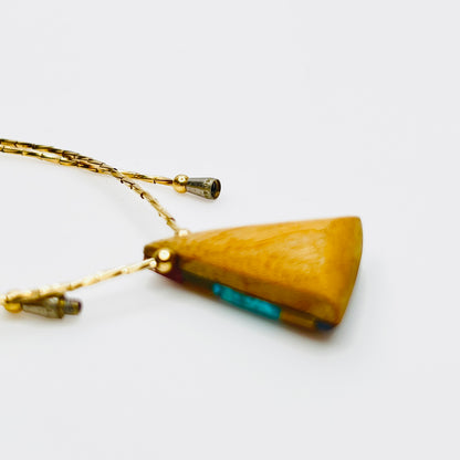Back of pendant wood triangle artisan necklace