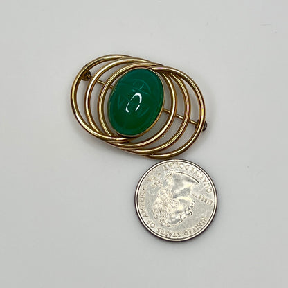 1950s gold-filled scarab brooch with green carved glass