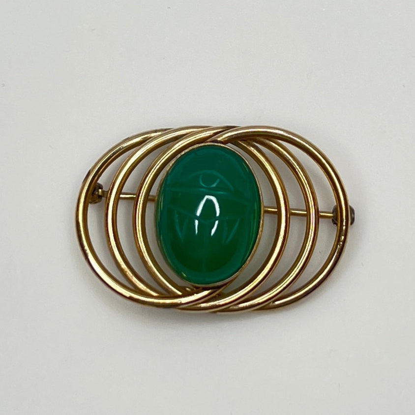 Mid-century Egyptian revival pin with concentric oval frame