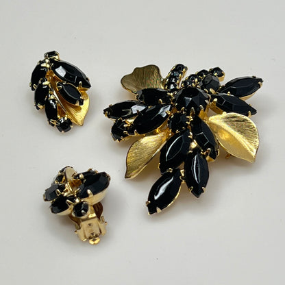 1950s vintage jewelry set with prong-set black stones and sculpted floral design