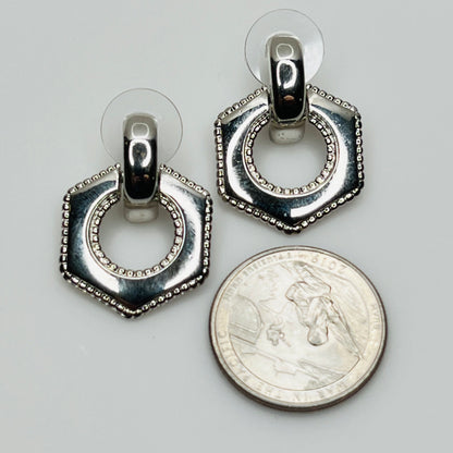 Earrings shown with U.S. quarter for size reference