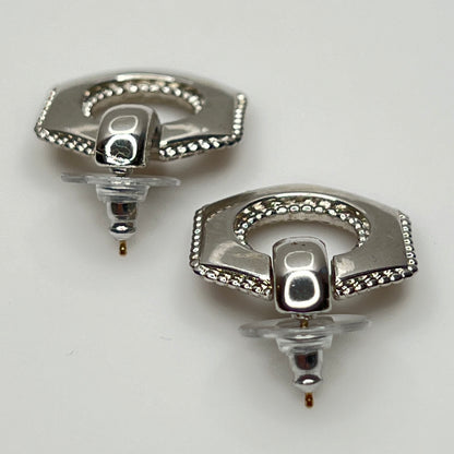 Close-up of earrings showing silver finish and 14K gold post with stabilizer backs