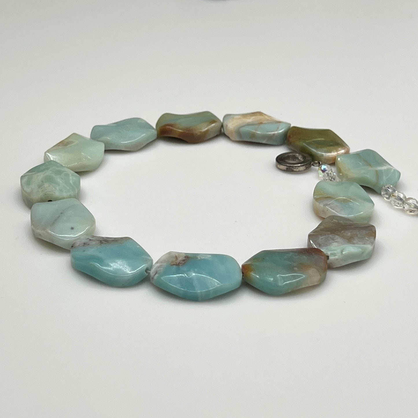 Full necklace laid flat showing bead shape and length