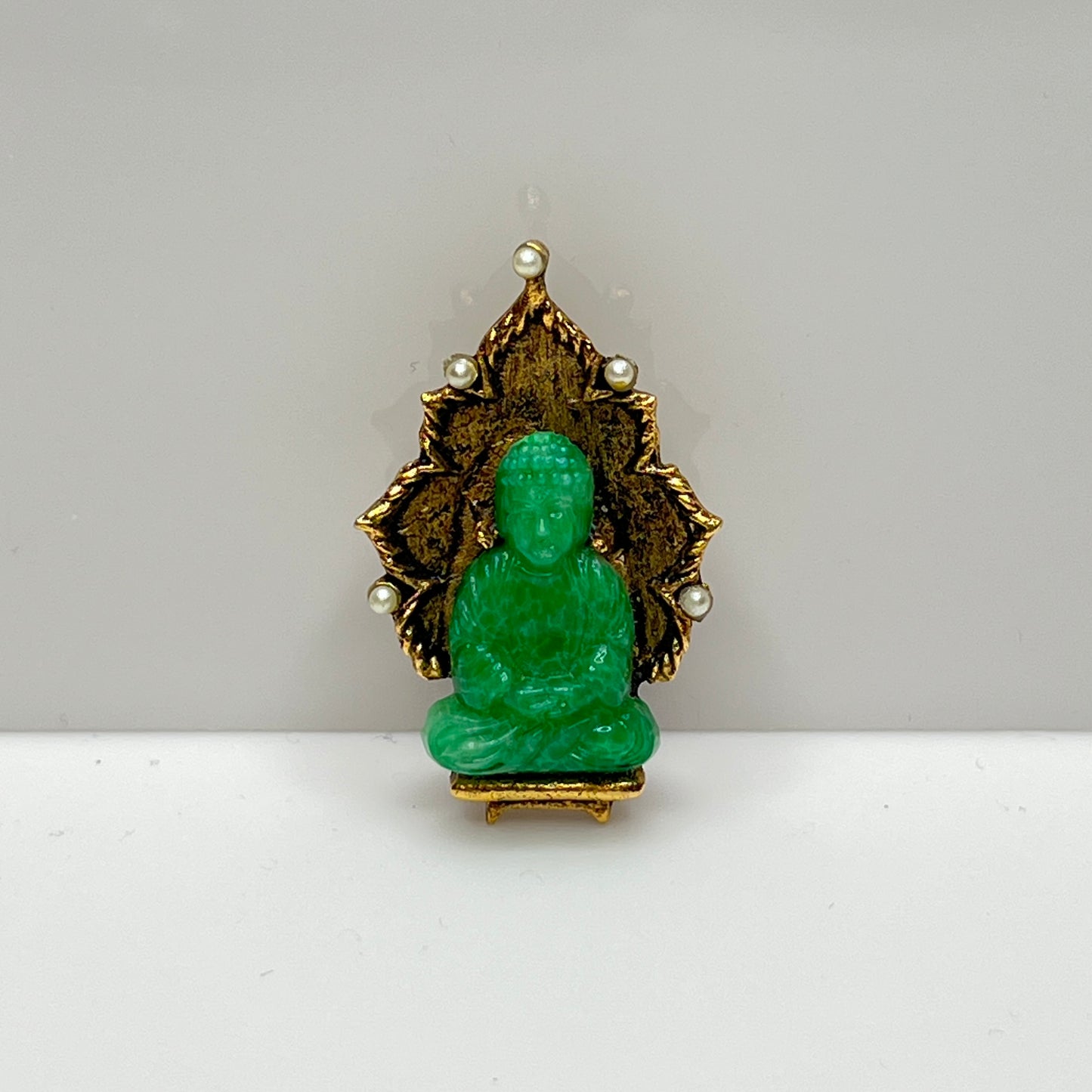 Vintage Ambassador Buddha brooch with jade glass figure and faux pearls