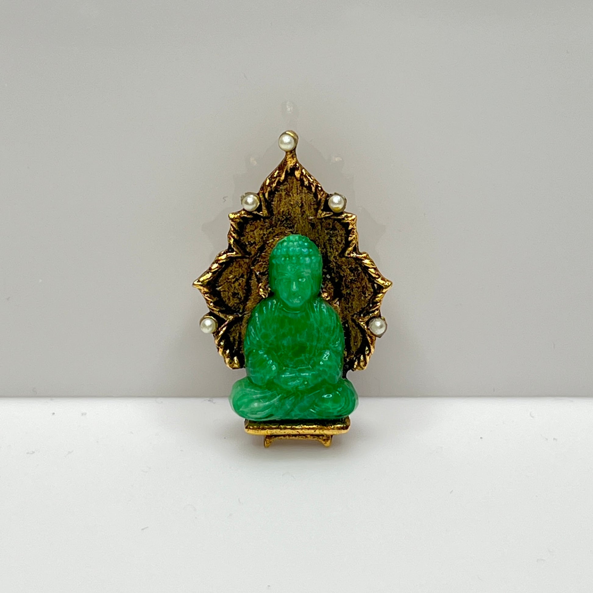 Vintage Ambassador Buddha brooch with jade glass figure and faux pearls