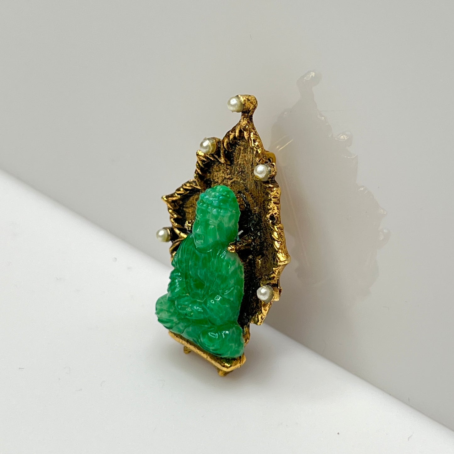 Vintage Ambassador Buddha brooch with jade glass figure and faux pearls