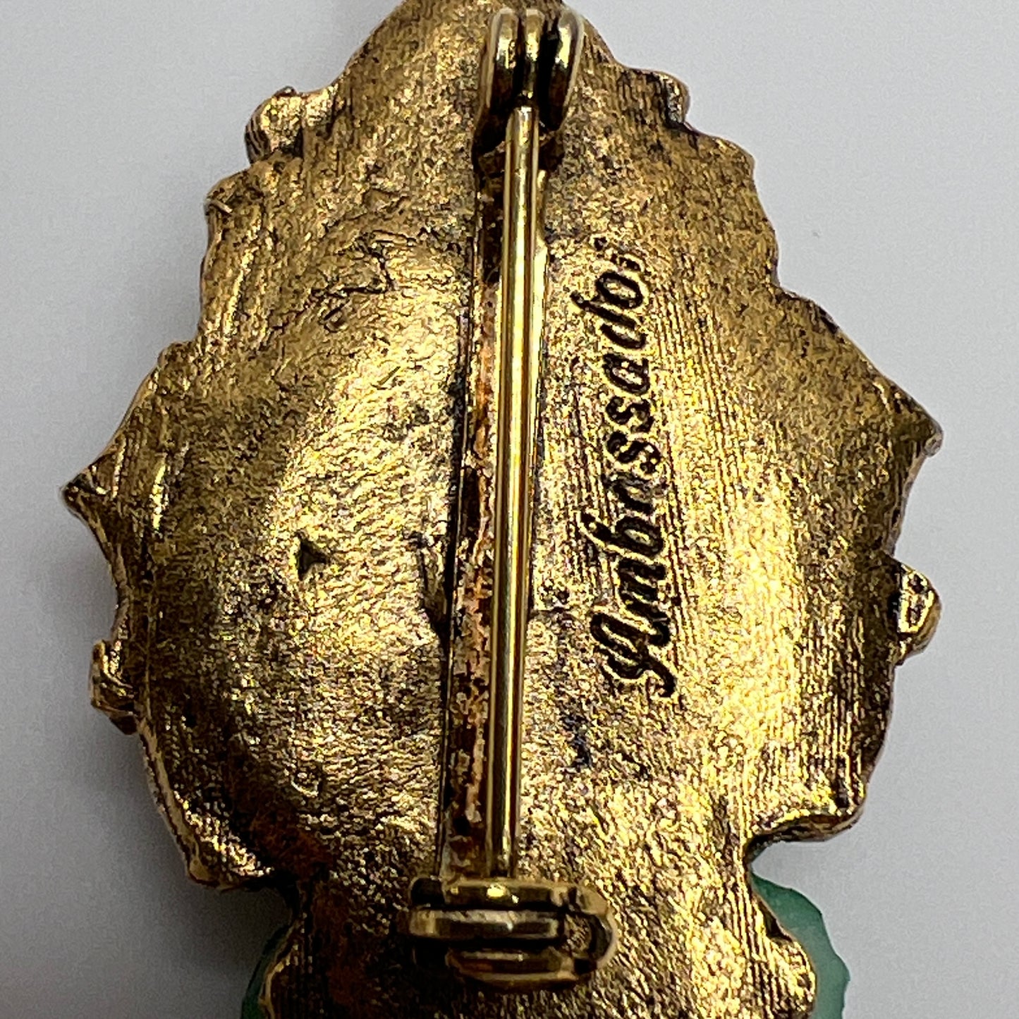 Mid-century gold-tone Buddha pin with lotus-style backdrop