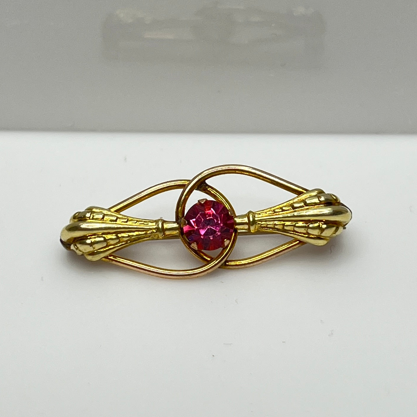 AMCO Art Nouveau bar brooch with pink rhinestone and 10K gold fill