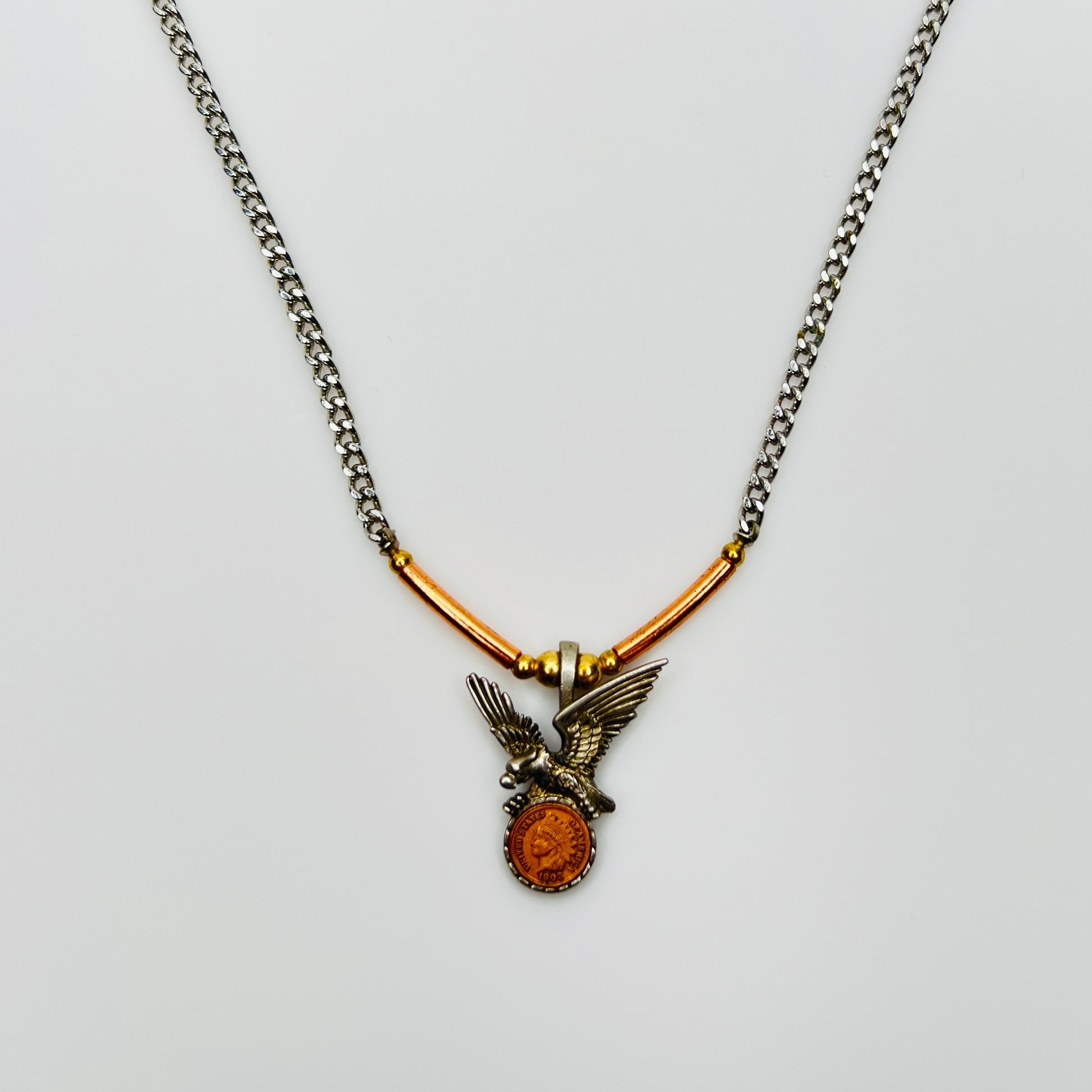 Mixed metal eagle pendant necklace with coin medallion detail