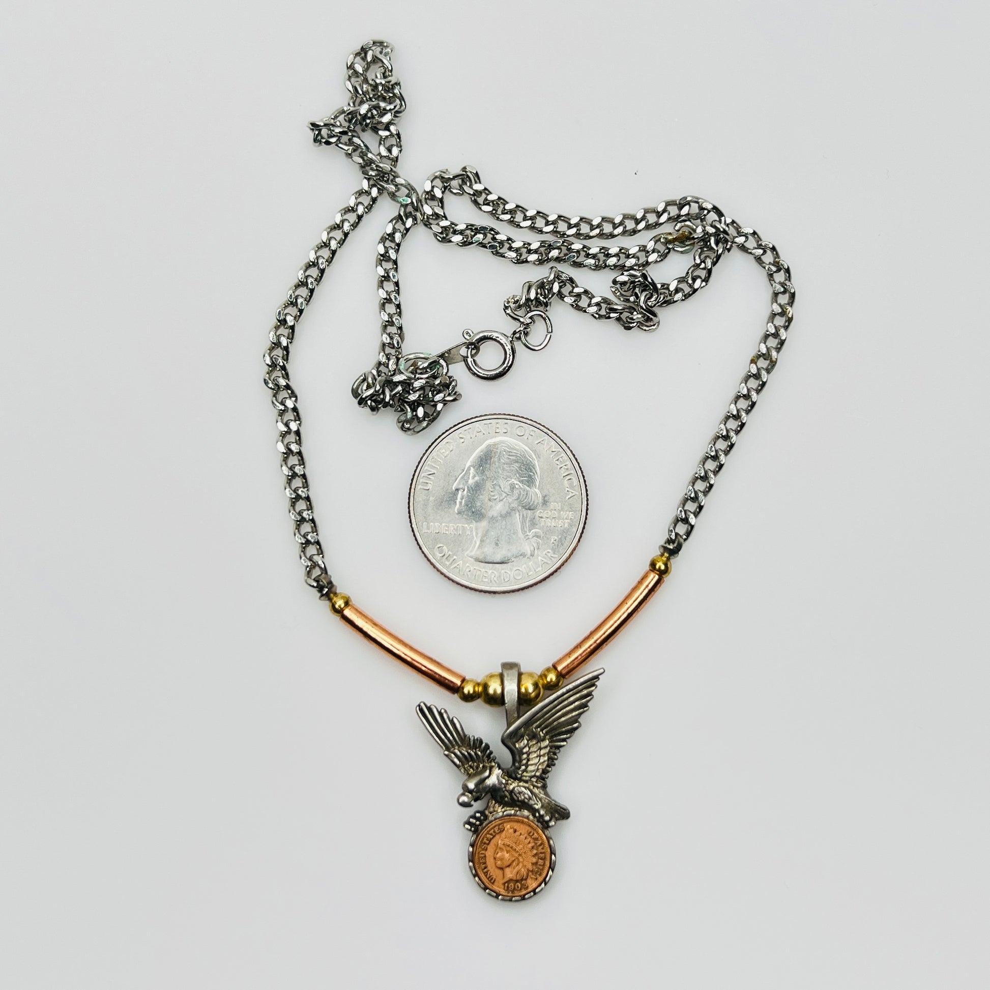 Full necklace with eagle coin pendant and chain, size reference with quarter
