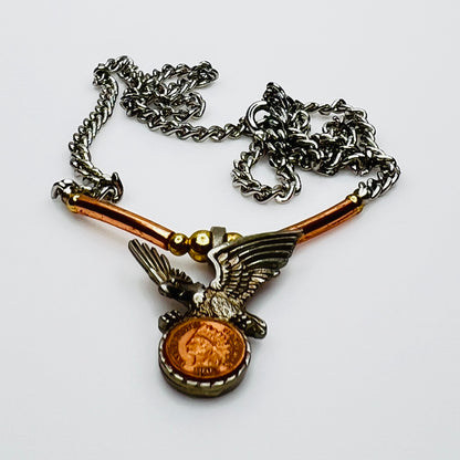 Side view of eagle pendant with copper tube accents on chain
