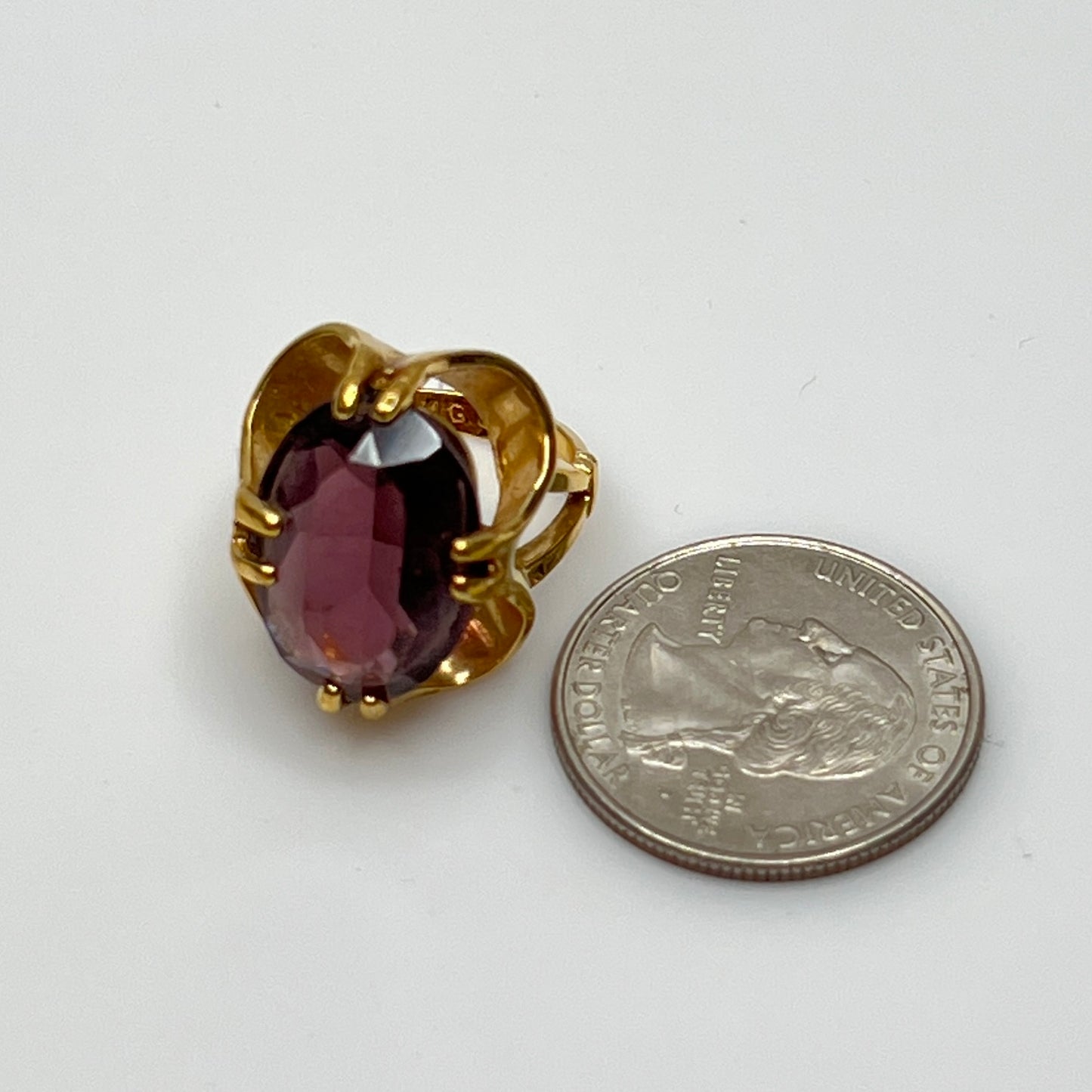 Purple crystal statement ring in yellow gold-tone floral setting