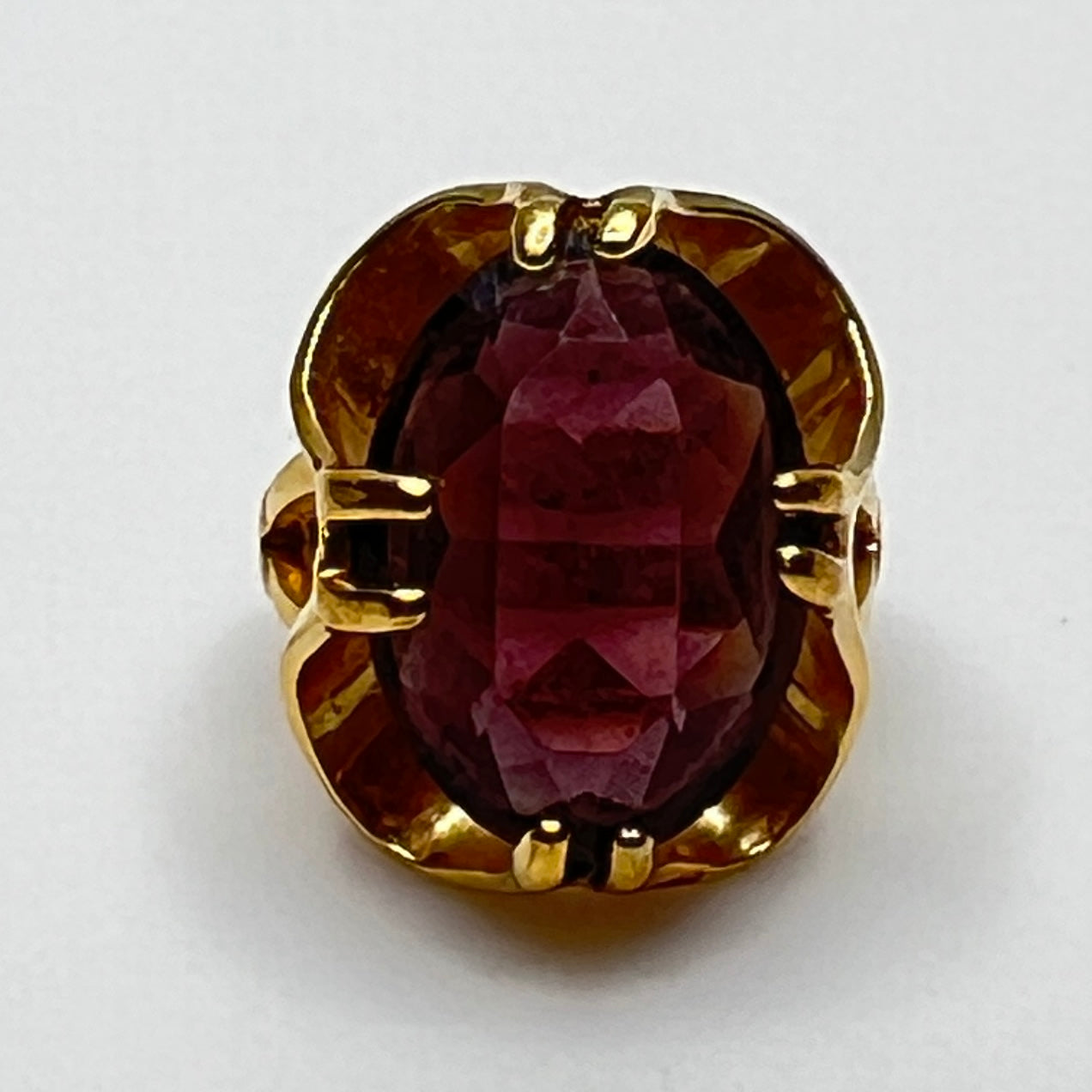 Purple crystal statement ring in yellow gold-tone floral setting