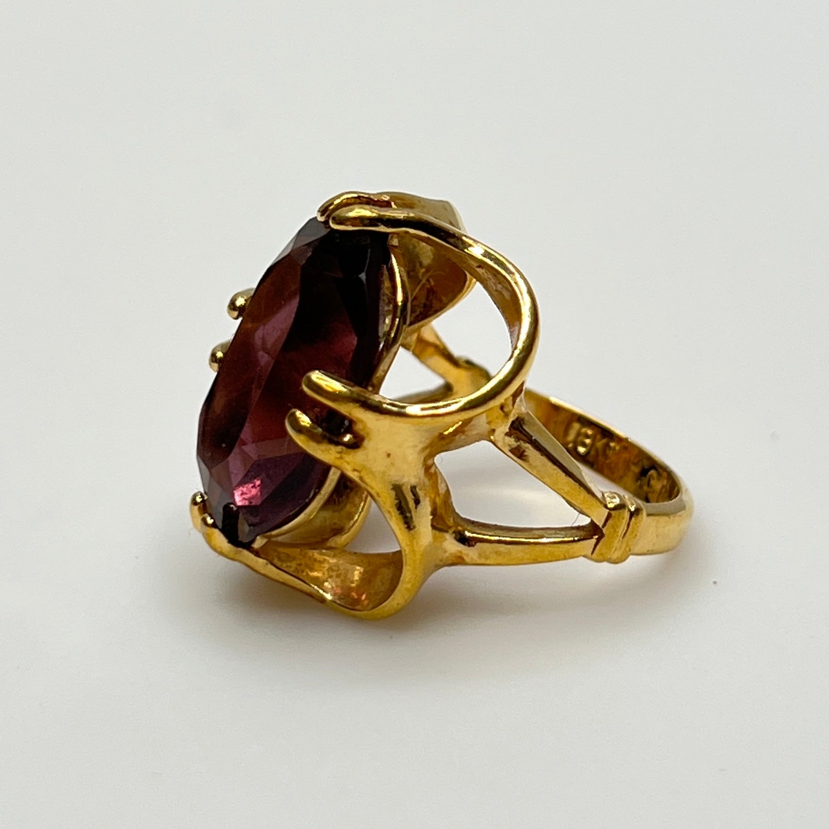 Purple crystal statement ring in yellow gold-tone floral setting