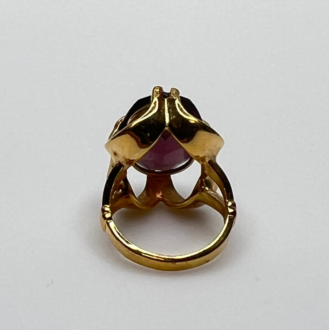 Purple crystal statement ring in yellow gold-tone floral setting