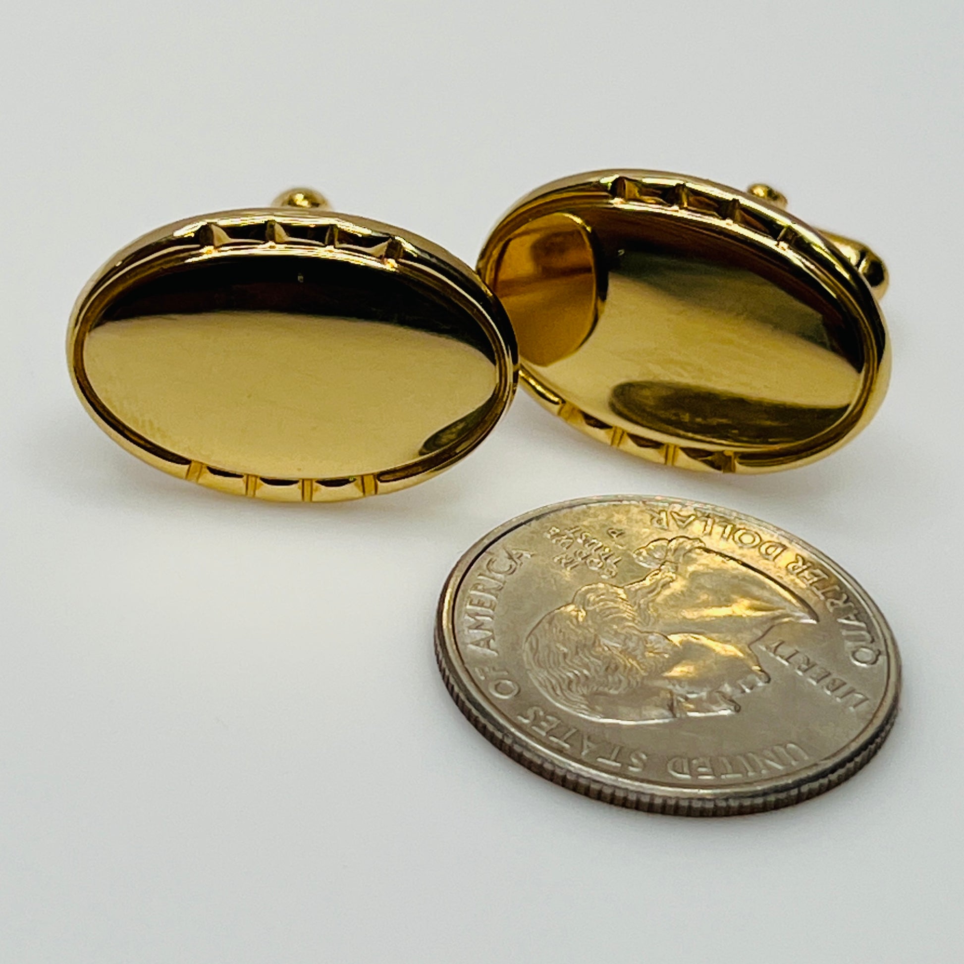Vintage Anson gold-tone oval cufflinks with faceted edge detail
