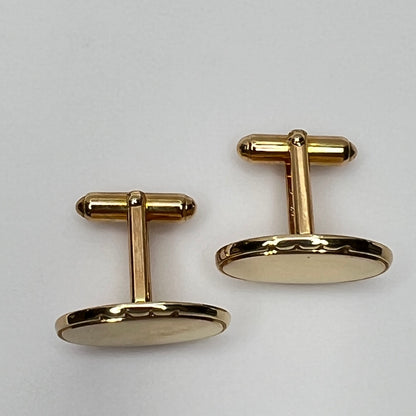 Vintage Anson gold-tone oval cufflinks with faceted edge detail