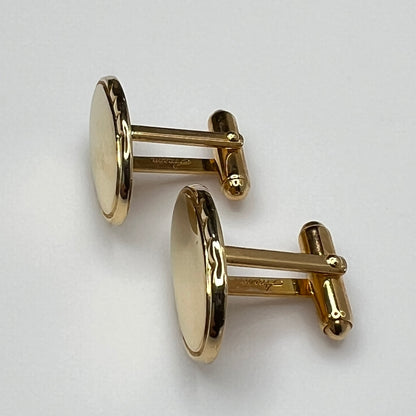 Mid-century gold oval cufflinks with high-polish finish and signed interior
