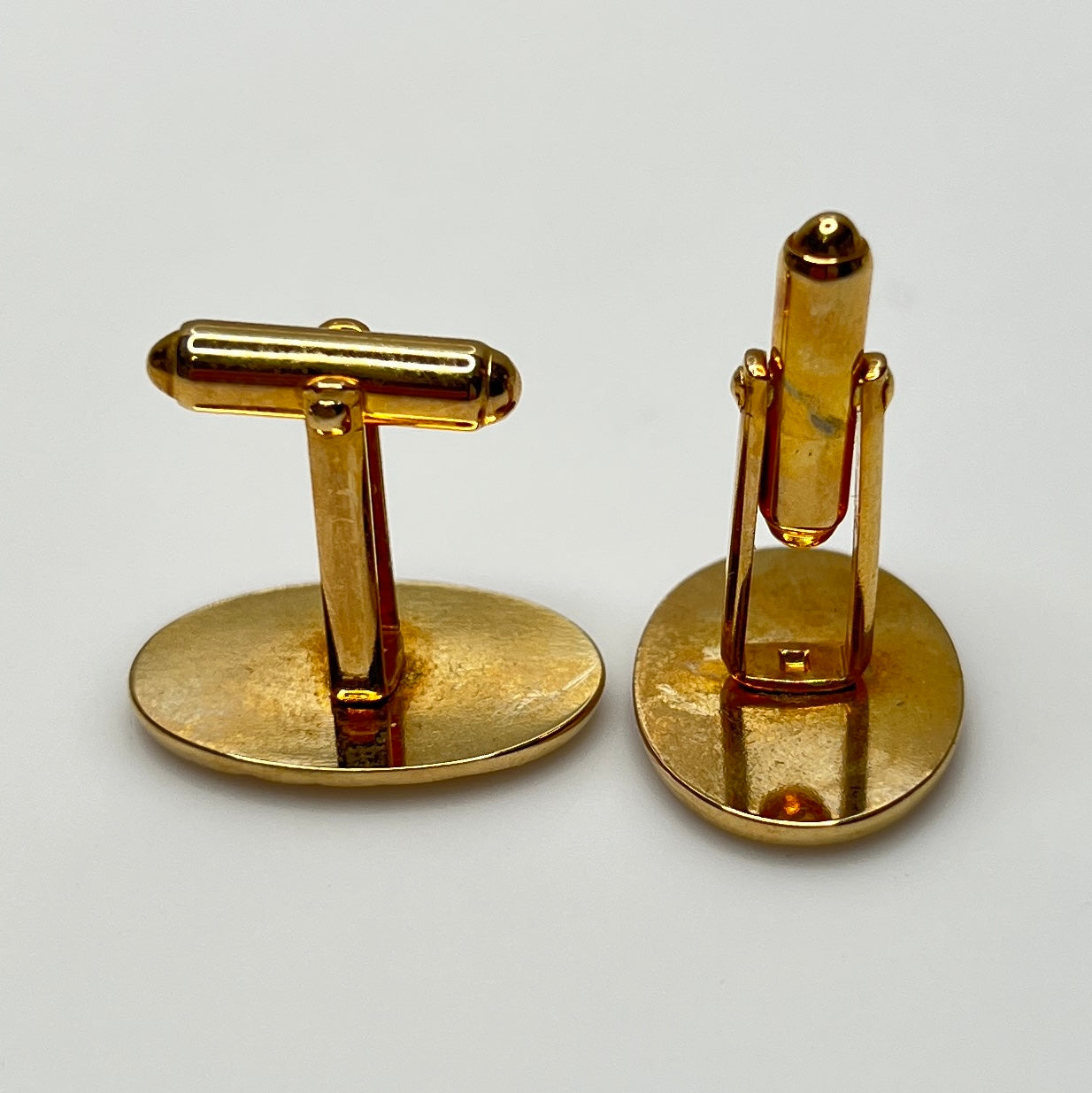 Mid-century gold oval cufflinks with high-polish finish and signed interior