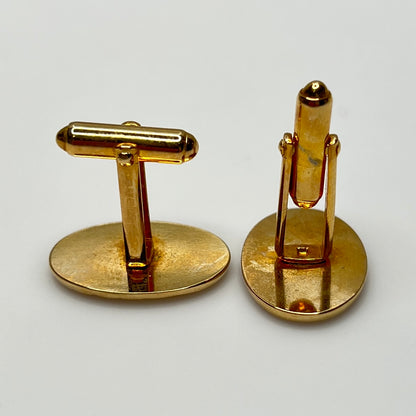 Mid-century gold oval cufflinks with high-polish finish and signed interior