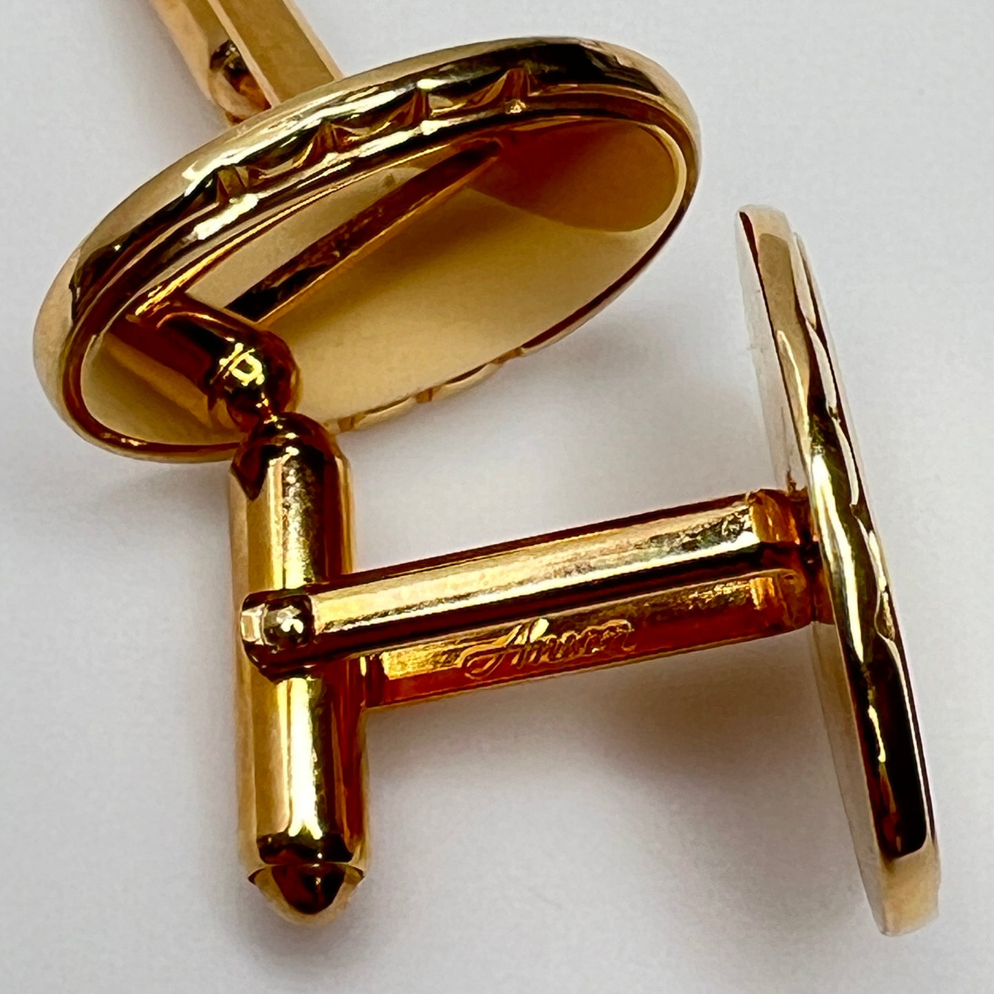 Mid-century gold oval cufflinks with high-polish finish and signed interior