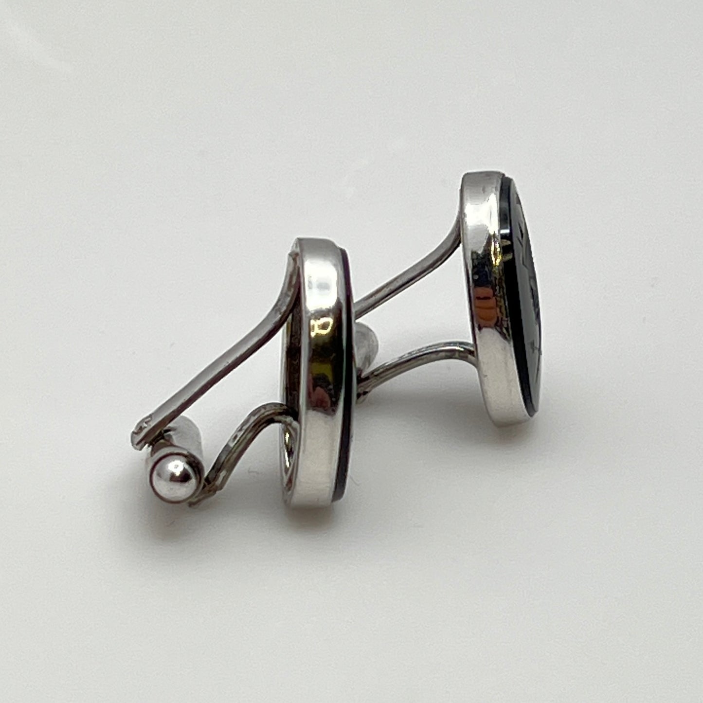 Close-up of Anson cufflink with sterling silver setting