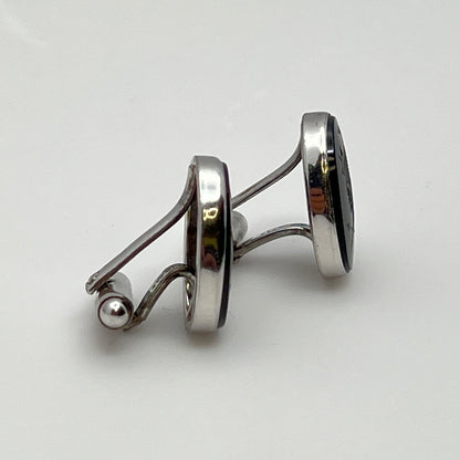 Close-up of Anson cufflink with sterling silver setting