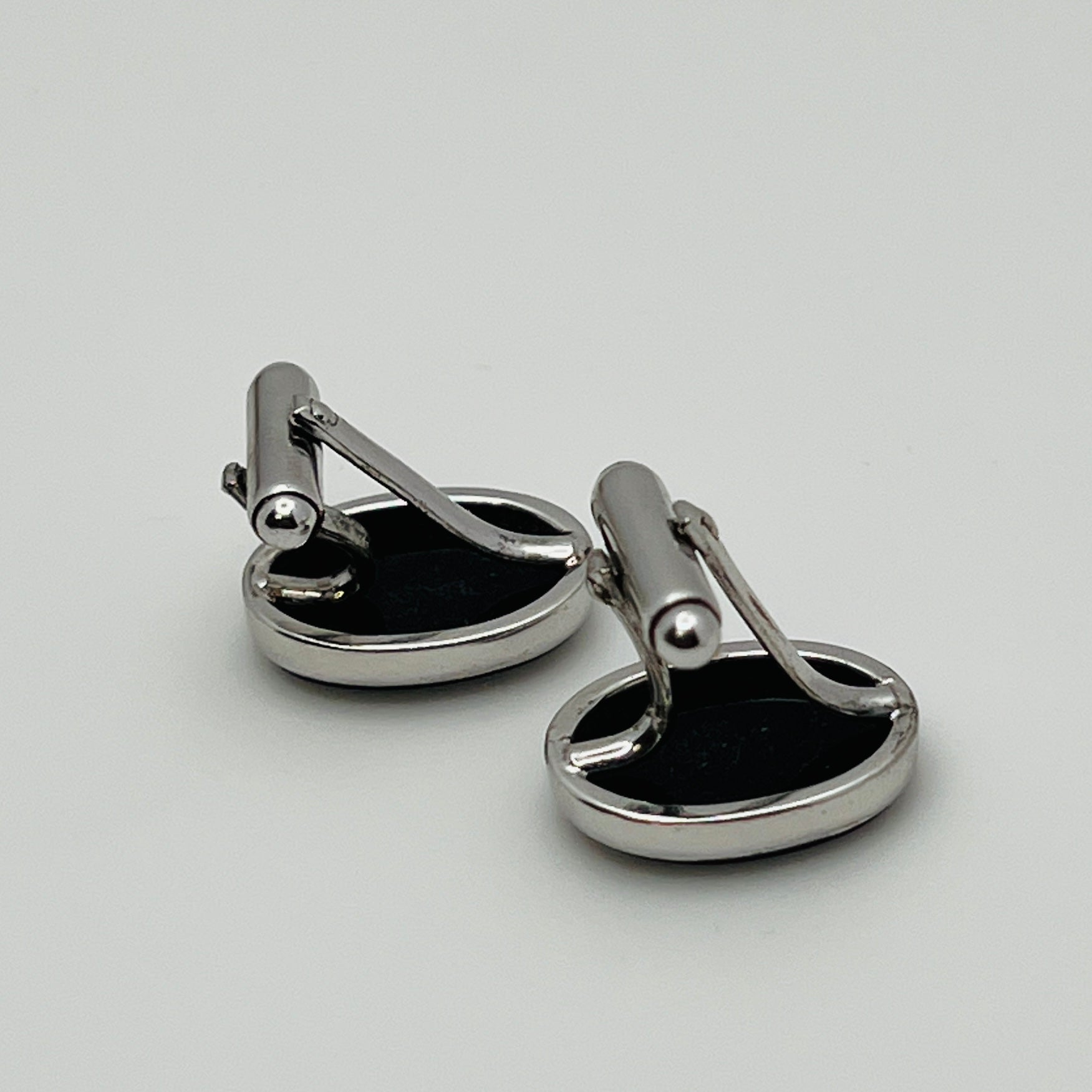 Close-up of Anson cufflink with sterling silver setting