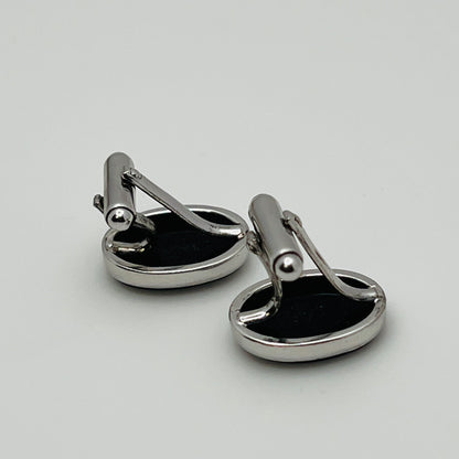 Close-up of Anson cufflink with sterling silver setting