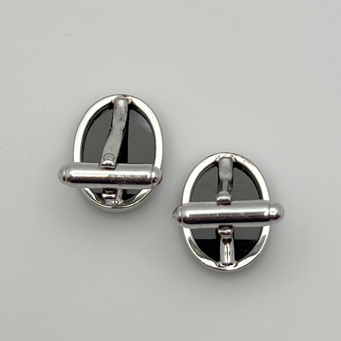 Close-up of Anson cufflink with sterling silver setting
