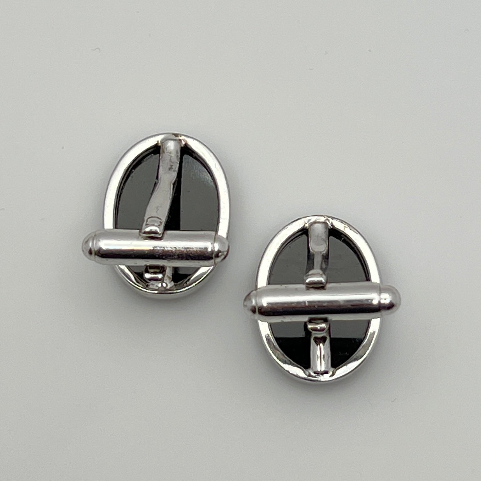 Close-up of Anson cufflink with sterling silver setting