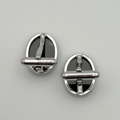 Close-up of Anson cufflink with sterling silver setting