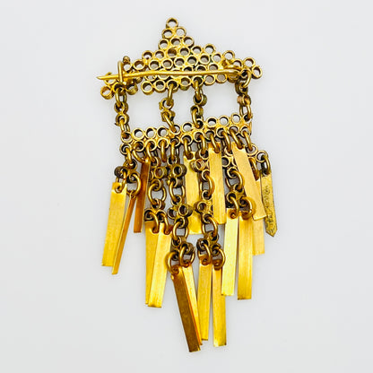 Reverse of antique Art Deco brass tassel brooch with C-clasp
