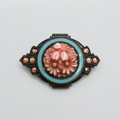 Victorian floral brooch with pink celluloid flowers and blue enamel frame