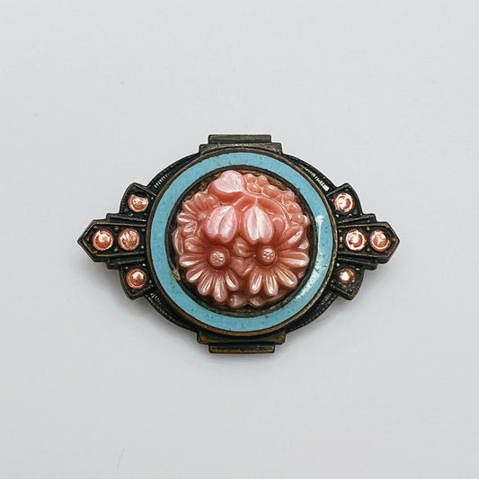 Victorian floral brooch with pink celluloid flowers and blue enamel frame