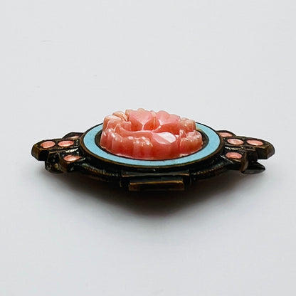 Side profile of Victorian enamel brooch with molded floral centerpiece