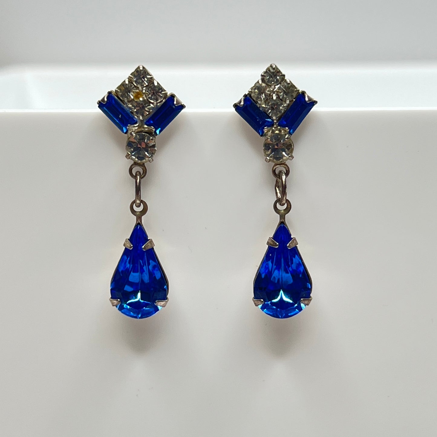 Vintage dangle earrings with deep blue and clear stones