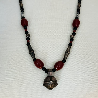 Vintage ethnic-inspired red ceramic and black glass bead necklace with matching earrings and silver-tone pendant