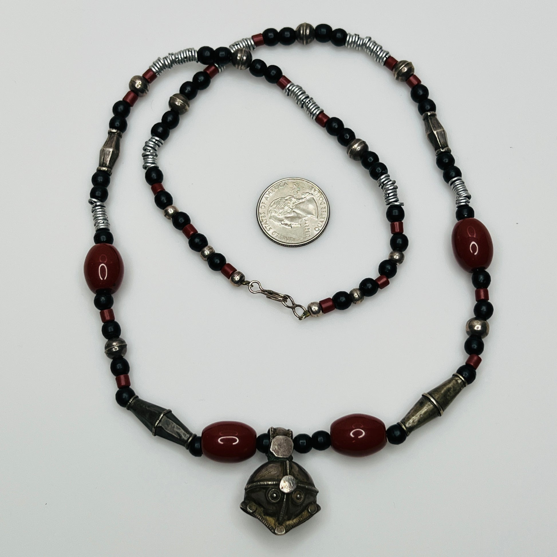 Vintage ethnic-inspired red ceramic and black glass bead necklace with matching earrings and silver-tone pendant