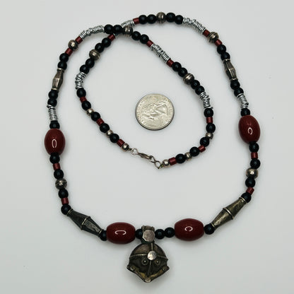 Vintage ethnic-inspired red ceramic and black glass bead necklace with matching earrings and silver-tone pendant