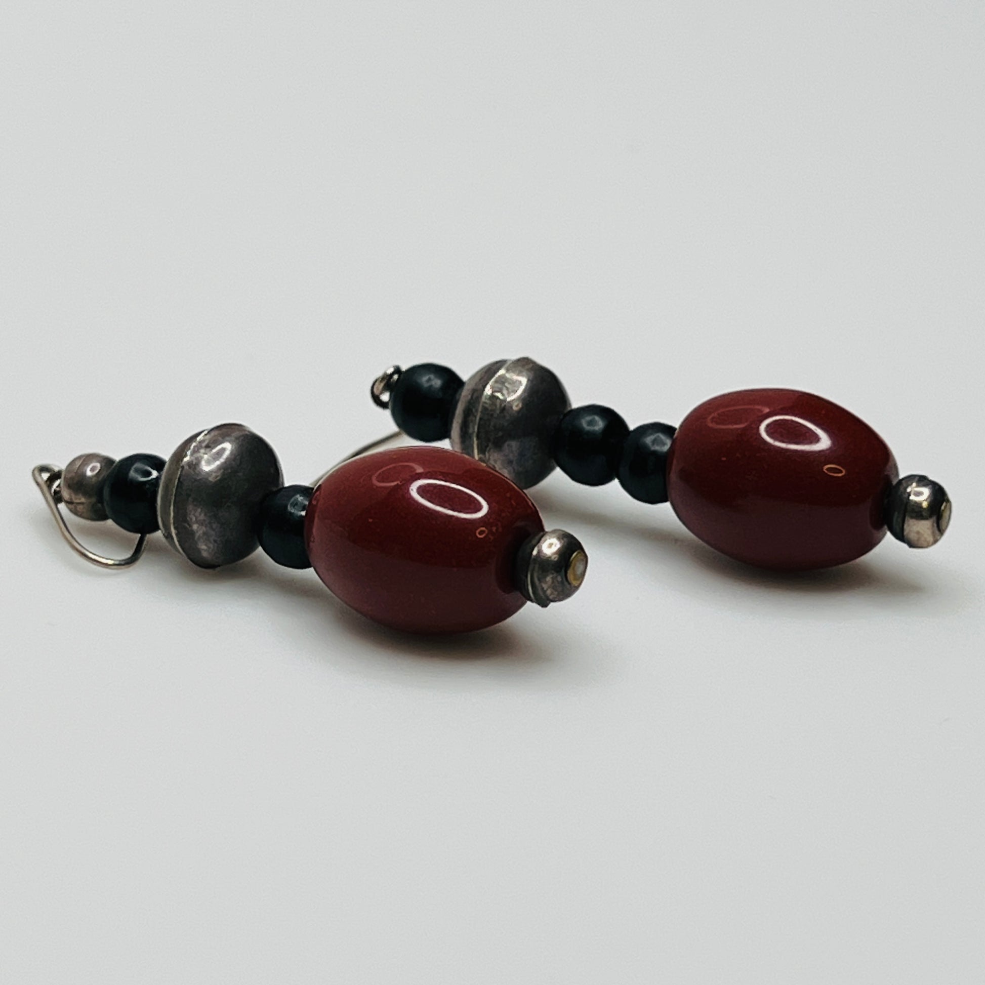 Vintage ethnic-inspired red ceramic and black glass bead necklace with matching earrings and silver-tone pendant