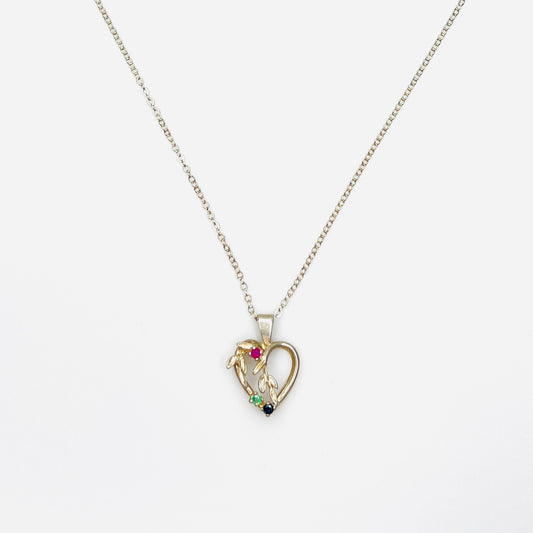 Vintage Avon sterling silver heart necklace with genuine ruby, emerald, and sapphire gemstones.